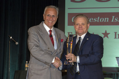 Jim Reid-Anderson, Chairman, President and CEO of Six Flags accepts Heritage Award from David Teel, President and CEO of the Texas Travel Industry Association (TTIA)