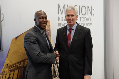 D. Wayne Robinson, president and CEO of Student Veterans of America (left), and Daniel J Crowley, president of Raytheon Integrated Defense Systems, announce the launch of the Raytheon Patriot Scholarship for U.S. Army student veterans during the 2014 AUSA Annual Meeting & Exposition.