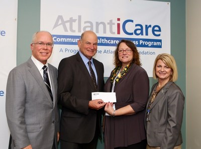 Left to right are David Tilton, president and CEO, AtlantiCare; Eugene Arnone, chair, AtlantiCare Health System Board; Evelyn Benton, executive director, Community FoodBank of New Jersey-Southern Branch; and Robyn Begley, RN, DNP, chief nursing officer, AtlantiCare and FoodBank Advisory Board member. The FoodBank is among six charities to which AtlantiCare is donating a total of $500,000 through its Community Healthcare Access Program...