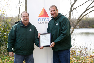 Village of Lemont Mayor Brian Reaves presents Jim Cristman, Vice President and General Manager of the CITGO Lemont Refinery, with a proclamation during the CITGO Lemont Quarry Restoration Project.