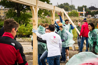 Astellas Pharma US employees help build a shelter at a conservation area on Sept. 12, 2014.