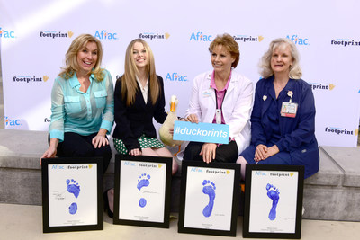 Aflac and the UC Davis Comprehensive Cancer Center in Sacramento honor 4 heroes in the fight against childhood cancer with the Aflac Duckprints Award. Left to right: Robyn Raphael, Francesca Arnaudo, the Aflac Duck, Katie Haertle, and Nancy Lewis