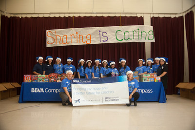 BBVA Compass Volunteers - clad in BBVA Compass Blue and dubbed the Blue Elves - gave new toys to nearly 200 kindergarten and second-grade students at Thigpen-Zavala Elementary School in McAllen, Texas as part of Project Blue Elf.