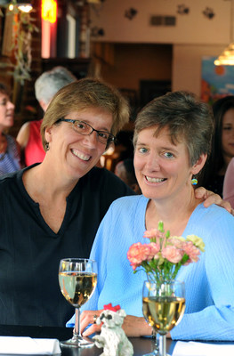 Town of Carrboro, NC Mayor Lydia Lavelle (L) and photographer Alicia Stemper, at the Spotted Dog restaurant in downtown Carrboro.  Lavelle and Stemper were married on October 25, 2014 at the Carrboro Town Commons two weeks after same-sex marriage became legal in North Carolina on October 10, 2014.  Lavelle and Stemper had a commitment ceremony in September 2004. Source: Chapel Hill/Orange County Visitors Bureau