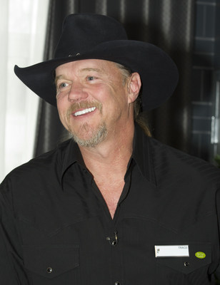 Trace Adkins appeared at a Country Inns & Suites By Carlson hotel in Nashville to demonstrate the hotel's signature "Be Our Guest" service philosophy on Thursday, Dec. 11, 2014 in Nashville, TN.