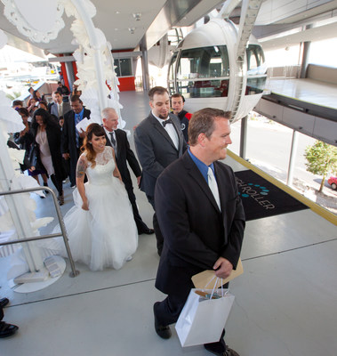 Nearly a hundred couples say "I Do" for free while riding the High Roller at the LINQ Promenade in Las Vegas on 12/13/14.
