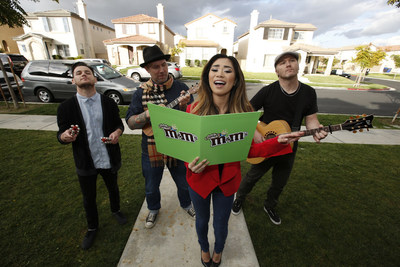 (December 18, 2014) Jessica Sanchez, celebrated singer and finalist on American Idol Season 11, spreads some sweet holiday cheer with the help of M&M'S(R) Crispy. Sanchez returned to her hometown of Chula Vista, CA, to surprise fans with holiday caroling and a special delivery of M&M'S(R) Crispy, which is returning to store shelves this month after a 10-year hiatus, thanks to a vocal fan base who pleaded for its return. (Photo by Christy Radecic/Invision for Mars Chocolate North America)/AP Images)