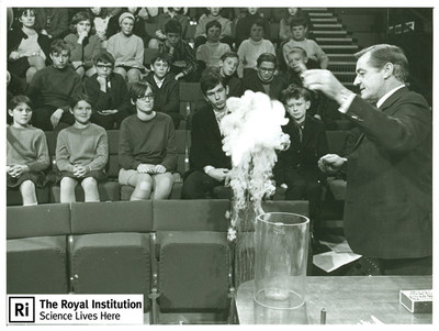 Children listen to a Royal Institution Christmas Lecture from George Porter in 1969. Since 1825 children and their parents have been enchanted by presentations of scientific and mathematical exploration delivered by the premier scientists of the day. As 2014 winners of the EMC Heritage Trust award, the Royal Institution will embark on a digitization project that will make these invaluable lectures available online to a global audience.