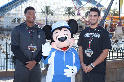 (December 27, 2014) - Florida State quarterback Jameis Winston (left) and Oregon quarterback Marcus Mariota (right), the two most recent Heisman Trophy winners, pose with Mickey Mouse in front of Mickey's Fun Wheel in Disney California Adventure park in Anaheim, Calif., on Saturday during their teams' first official Rose Bowl Game week appearance. (Scott Brinegar/Disneyland)