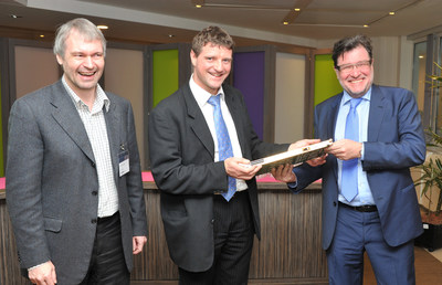 Geert Heyninck (L), General Manager of Alcatel-Lucent's Broadband Access business, presents a golden line card representing 10 million VDSL2 vectoring shipments to Patrick Delcoigne (C), Head of Fixed Access Networks, and Johan Luystermans (R), Director Network, Engineering & Operations at Proximus.