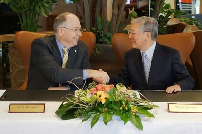 Johnson Controls CEO Alex Molinaroli and Hitachi CEO Hiroaki Nakanishi entered into a joint venture definitive agreement at the World Economic Forum in Davos, Switzerland, on Jan. 21, 2015.