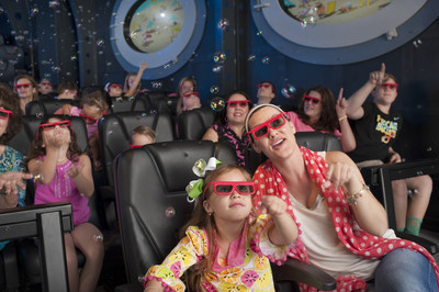 Children and parents wearing 3D glasses enjoy a wild and silly submarine voyage as they're immersed in special effects during the SpongeBob SubPants Adventure opening Memorial Day Weekend at Moody Gardens in Galveston, Texas.