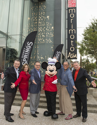 Disney Springs Vice President Keith Bradford, Disney Springs and ESPN Wide World of Sports Complex Senior Vice President Maribeth Bisienere, Walt Disney World Resort President George A. Kalogridis, Mickey Mouse, Chef Masaharu Morimoto and Patina Restaurant Group CEO Nick Valenti celebrate the opening of Morimoto Asia Sept. 29, 2015 at the newly named Disney Springs complex at Walt Disney World Resort in Lake Buena Vista, Fla. Re-imagined from Downtown Disney, Disney Springs is doubling the number of shopping, dining and entertainment experiences opening in phases through 2016. (David Roark, photographer).