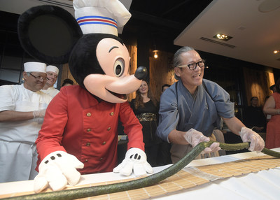 Morimoto Asia staged a media opening Tuesday as a new dining experience at Disney Springs at Walt Disney World Resort. Master Chef Morimoto not only put his knifing skills on display by breaking-down a 100lb big eye tuna in front of guests, he then worked with a team of chefs and special guests, including Mickey Mouse, in creating a 60-foot long maki roll.  Morimoto Asia opens to the public on Wednesday, Sept. 30 at 5pm.  (Phelan M. Ebenhack, photographer)
