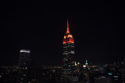 The Empire State Building Glowing Red and Gold