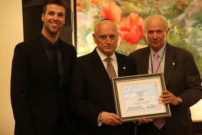 Michael Evans Jr. presenting John Patterson Leadership Award to Executive Vice Chairman and CEO Malcolm Hoenlein and Conference of Presidents Chairman Stephen M. Greenberg