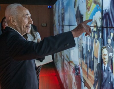 Former Israeli President Shimon Peres, International Chairman of the Friends of Zion (FOZ) Museum in Jerusalem, activating a historical figure on the largest interactive mural in Israel, located at the museum, honoring non-Jews who support Israel and the Zionist vision.