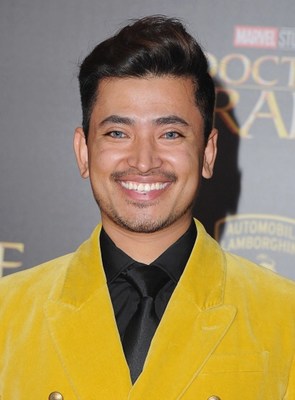 Pritan Ambroase flashes a million dollar smile on the red carpet at the world premiere of Doctor Strange. Ambroase is wearing Jeffery Rudes.