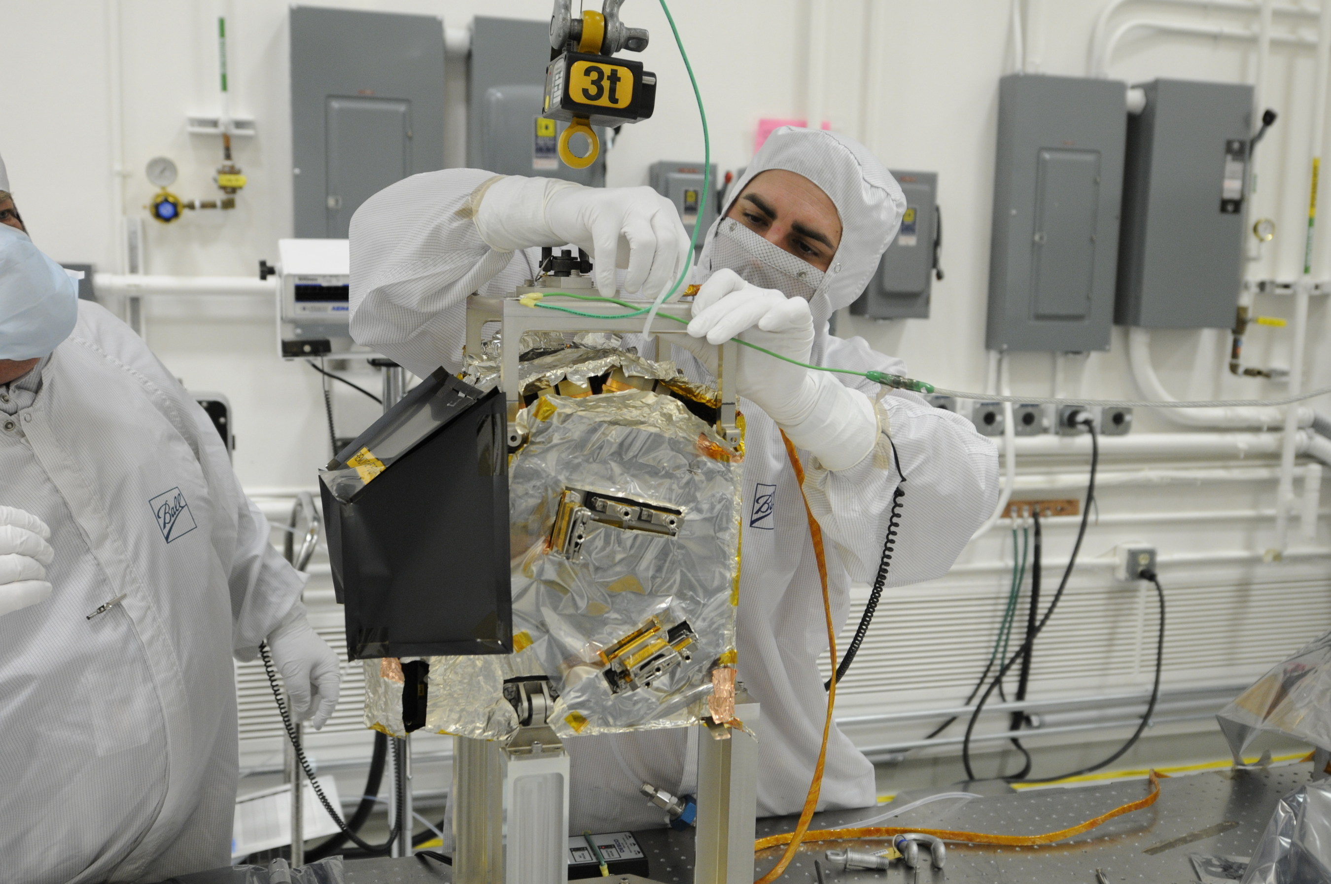 A Ball Aerospace technician prepares to integrate the Ozone Mapping Profiler Suite (OMPS) to the Joint Polar Satellite System spacecraft.  OMPS and the Clouds and Earth's Radiant Energy System are the first two of five instruments to be integrated to JPSS-1, the nation's next polar-orbiting weather satellite for NOAA and NASA, scheduled to launch in 2017.