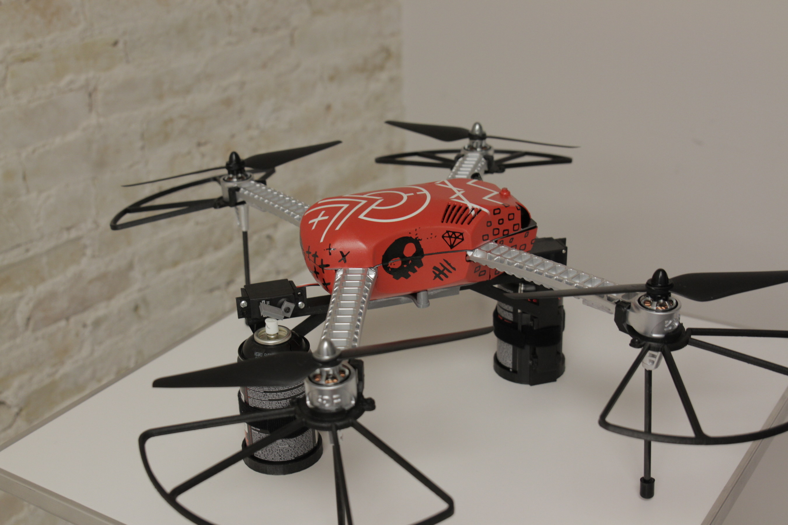 Chaotic Moon's Drone Tyrone outfitted with spray paint cans