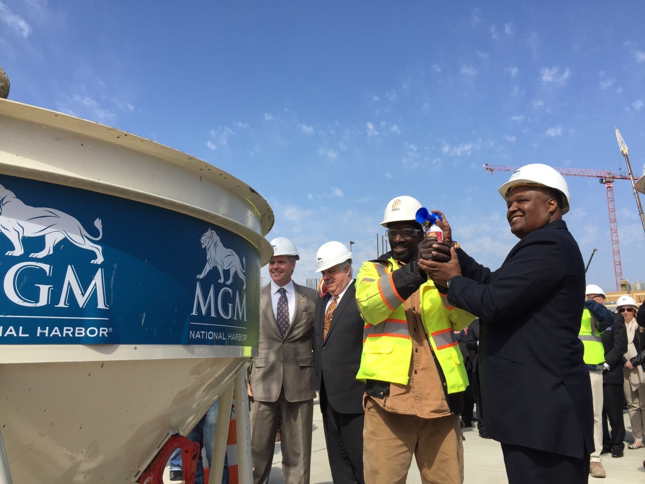 MGM National Harbor celebrates the hiring of the resort's 1000th construction employee with (Left to right) MGM Resorts International Chairman and CEO Jim Murren, Maryland Governor Larry Hogan, Essex Construction Labor Foreman Thomas Turner and Rushern Baker, County Executive of Prince George's County, MD.