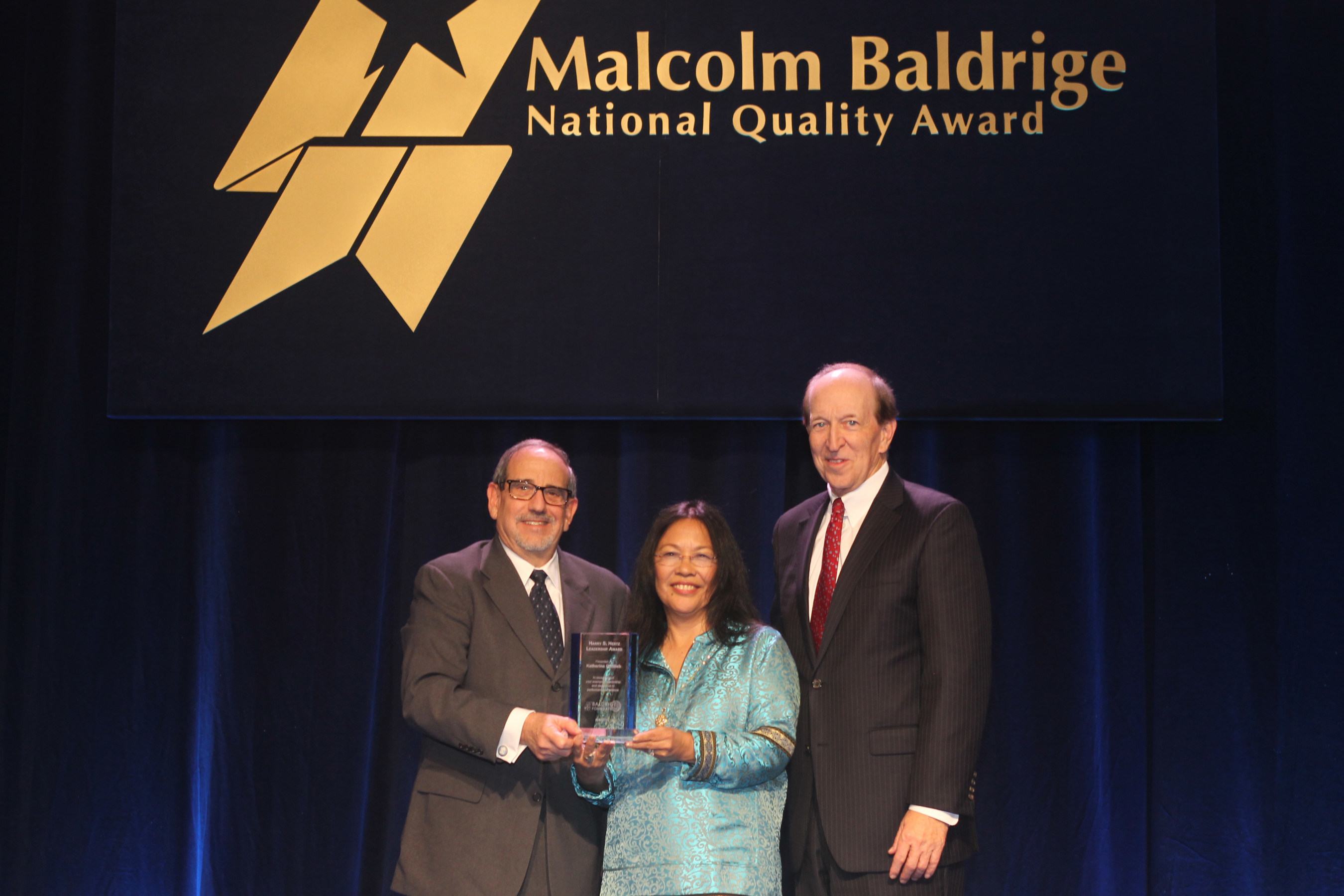 (Left-Right) 2013 HSHLA Recipient and Baldrige Performance Excellence Program Director Emeritus Harry S. Hertz, 2015 HSHLA Recipient and Southcentral Foundation President/CEO Dr. Katherine Gottlieb and Baldrige Foundation Chair Dr. P. George Benson