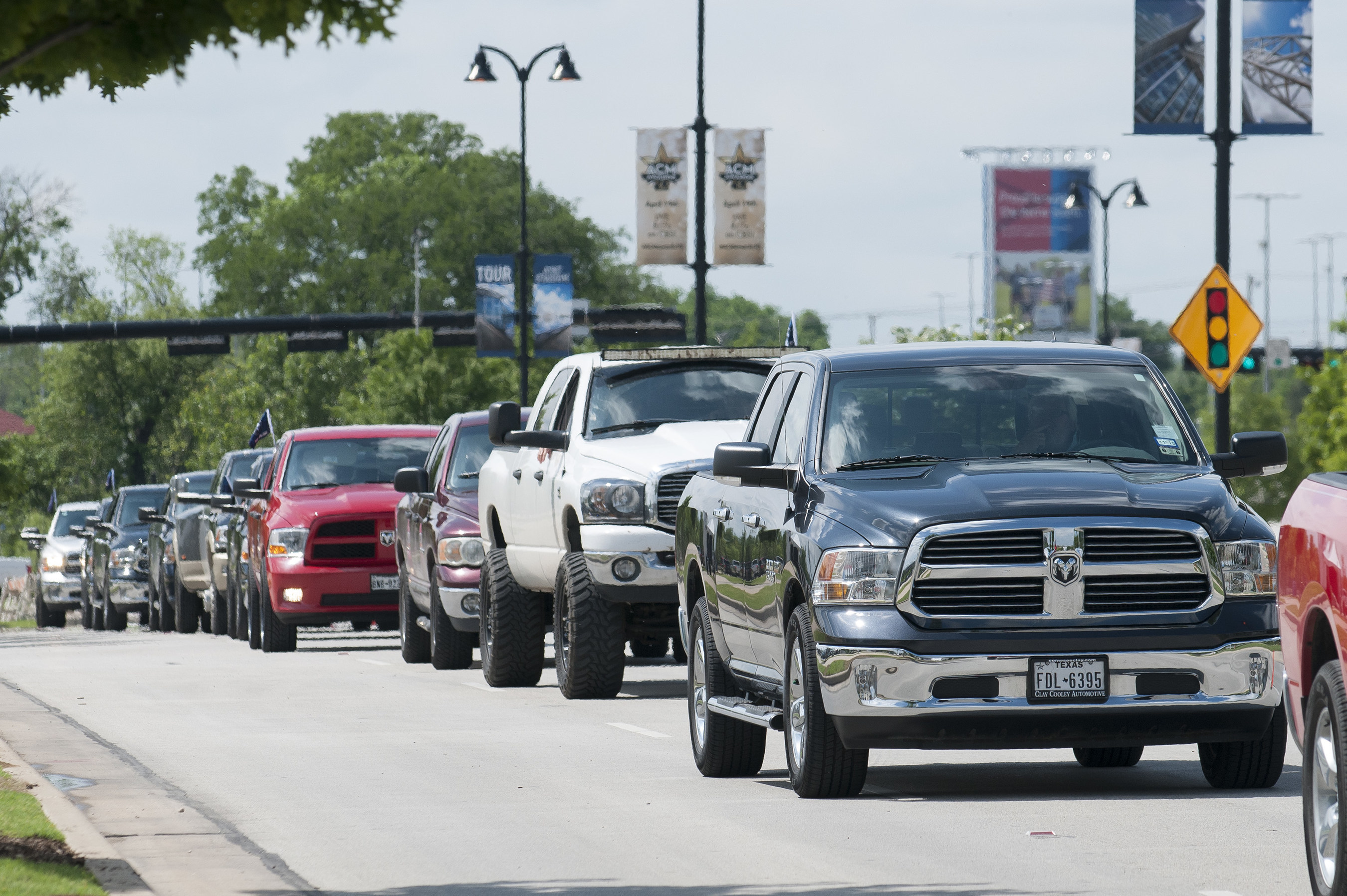 Ram Trucks parade near AT&T Stadium while setting a new Guinness World Records title for largest parade of pickup trucks with 451, in Arlington, Texas, Saturday, April 18, 2015.  The 'Ram Truck Round-up' was held in conjunction with the 50th Academy of Country Music Awards weekend.