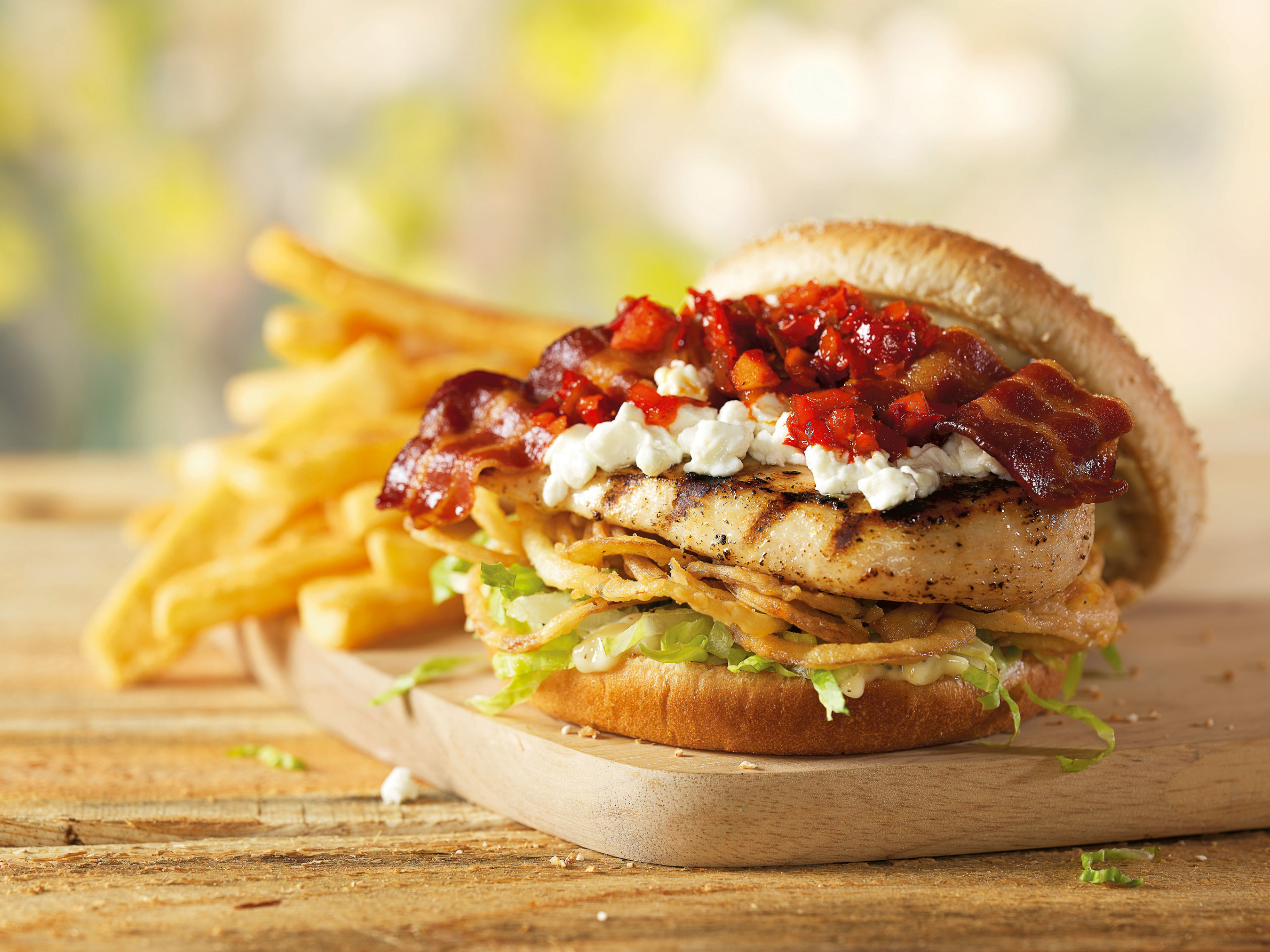 Red Robin Gourmet Burger's new Spring Chicken Burger, available for a limited time, is a tasty combination of fire grilled chicken topped with bacon strips, goat cheese, sweet pepper salsa, crunchy onion straws and lettuce, served with roasted garlic aioli on a whole grain bun.