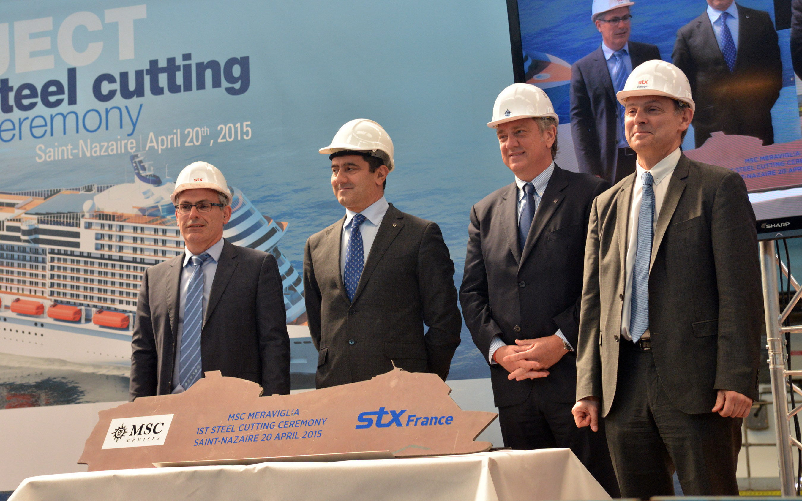 Marked by a steel cutting ceremony today in Saint-Nazaire, work is now underway for the first of MSC Cruises' $5.4 billion, 7-ship investment plan to double its capacity by 2020. Pictured from left to right: Jean-Yves Jaouen, Senior Vice President of Operations, STX France; Gianni Onorato, Chief Executive Officer, MSC Cruises; Pierfrancesco Vago, Executive Chairman, MSC Cruises; Laurent Castaing, General Manager, STX France