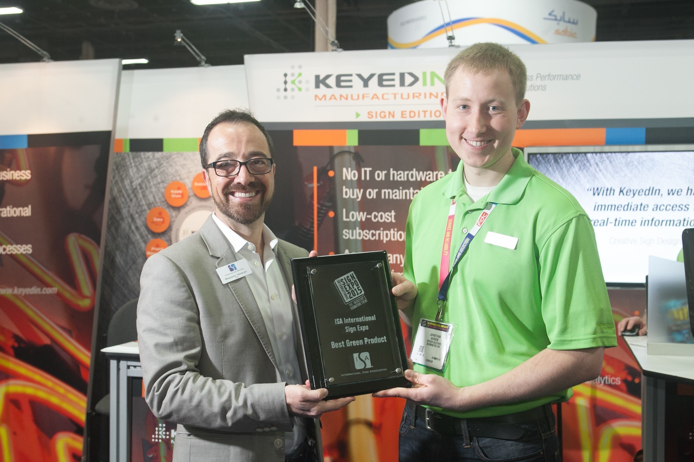 KeyedIn Solutions' Johnathan Warren proudly accepts the "Best Green Product" award from ISA COO, Brandon Hensley.