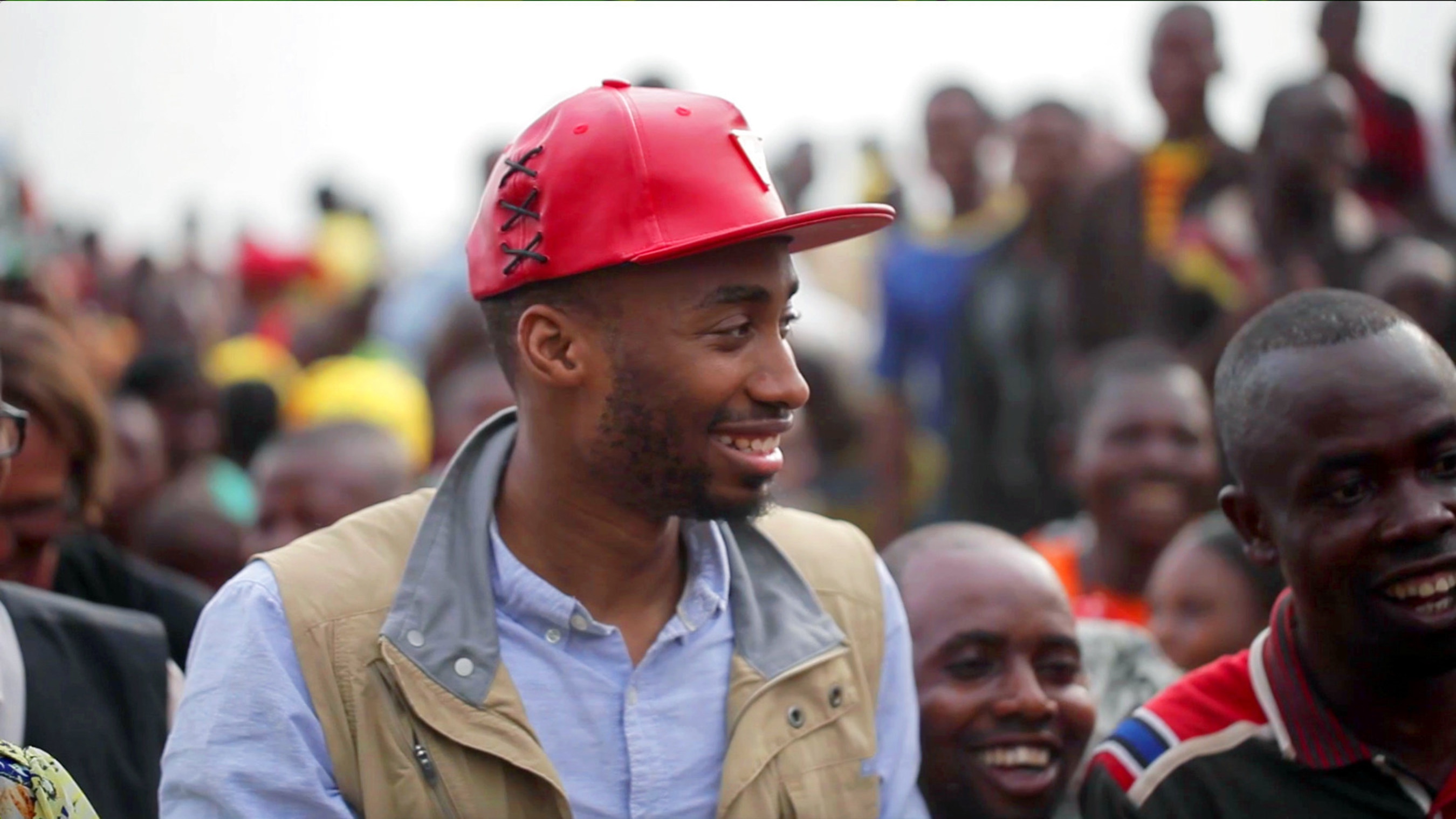 Prince Ea is welcomed in song by thousands of members of the community of Lokanga in the Wildlife Works Mai Ndombe REDD  Project region in the Democratic Republic of the Congo.