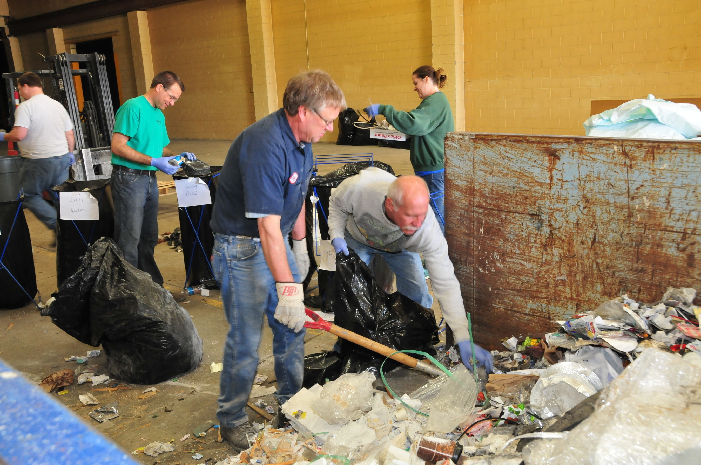 Curries employees participate in a dumpster dive to find out how they can manage their waste more responsibly.