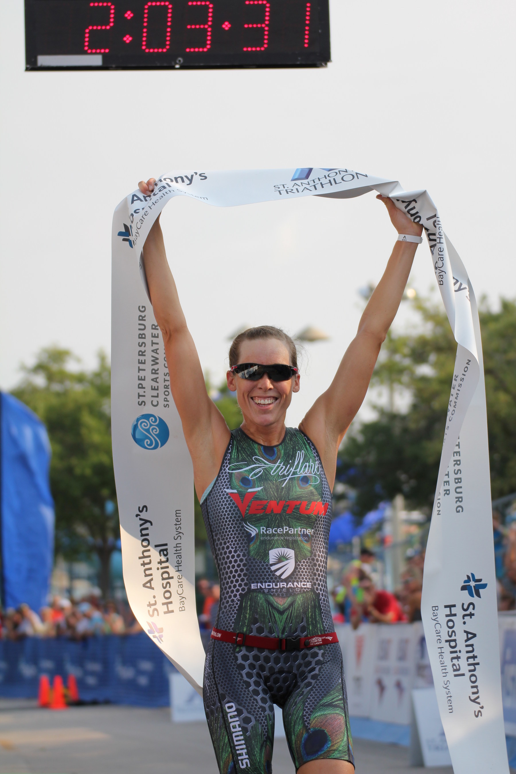 Alicia Kaye is the first female competitor across the finish line at the St. Anthony's Triathlon