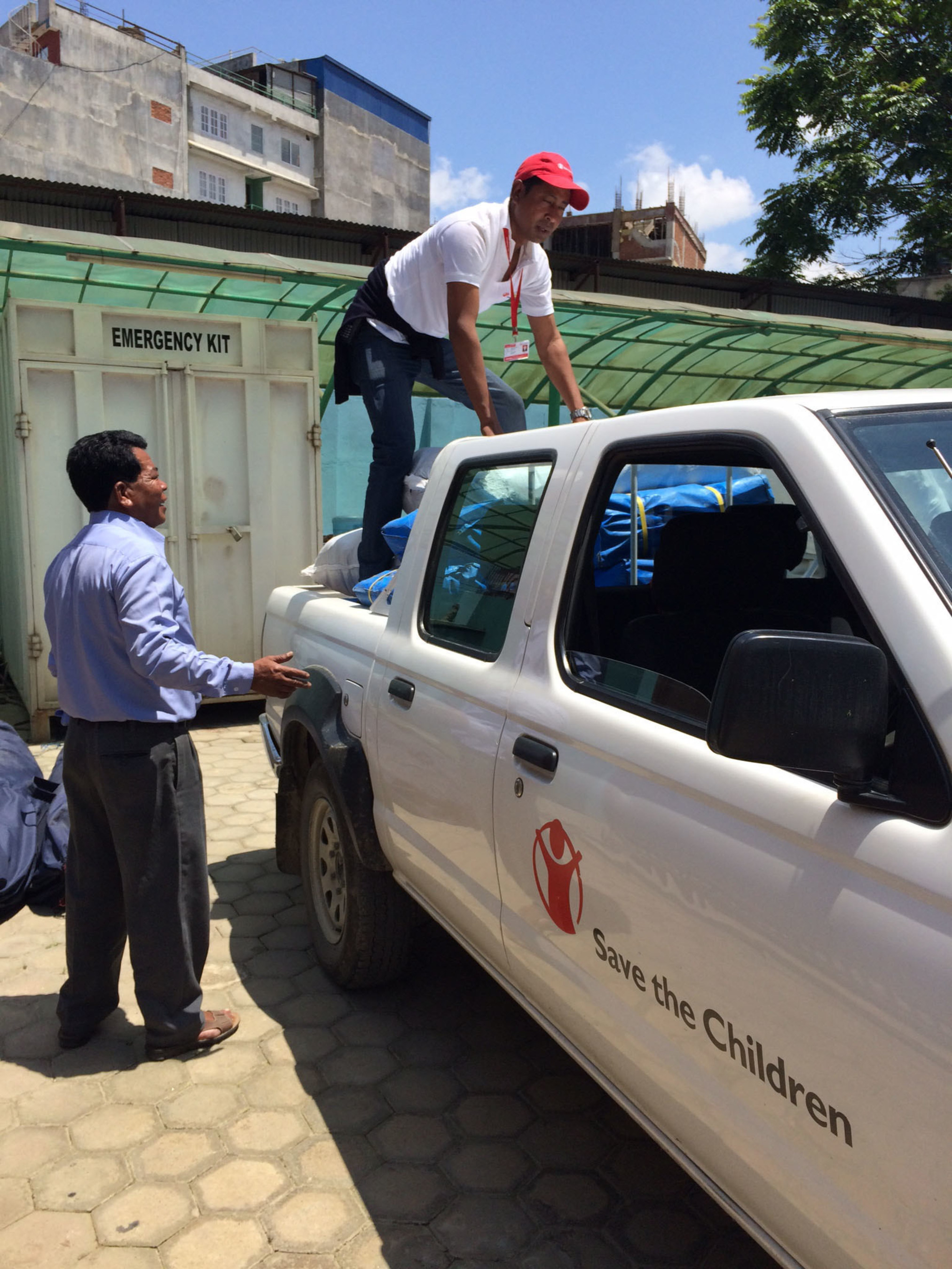 Save the Children staff unload emergency supplies for children and families left homeless by the earthquake in Nepal.