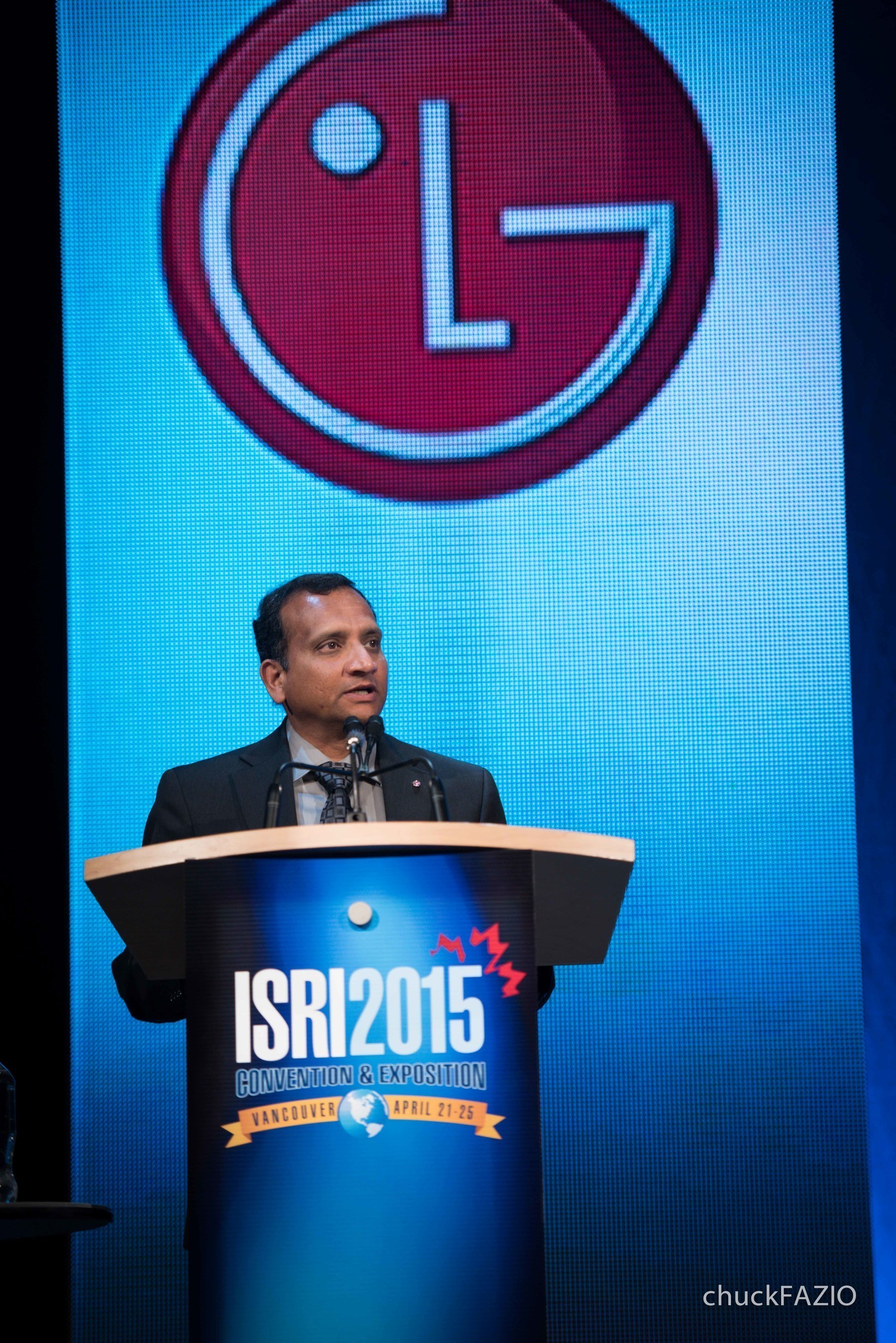 Dr. Nandhu Nandakumar, senior vice president, LG Technology Center of America, accepts the 2015  ISRI Design for Recycling(R) Award presented to LG Electronics for lifecycle designs of LG's OLED and 4K Ultra HD TVs.