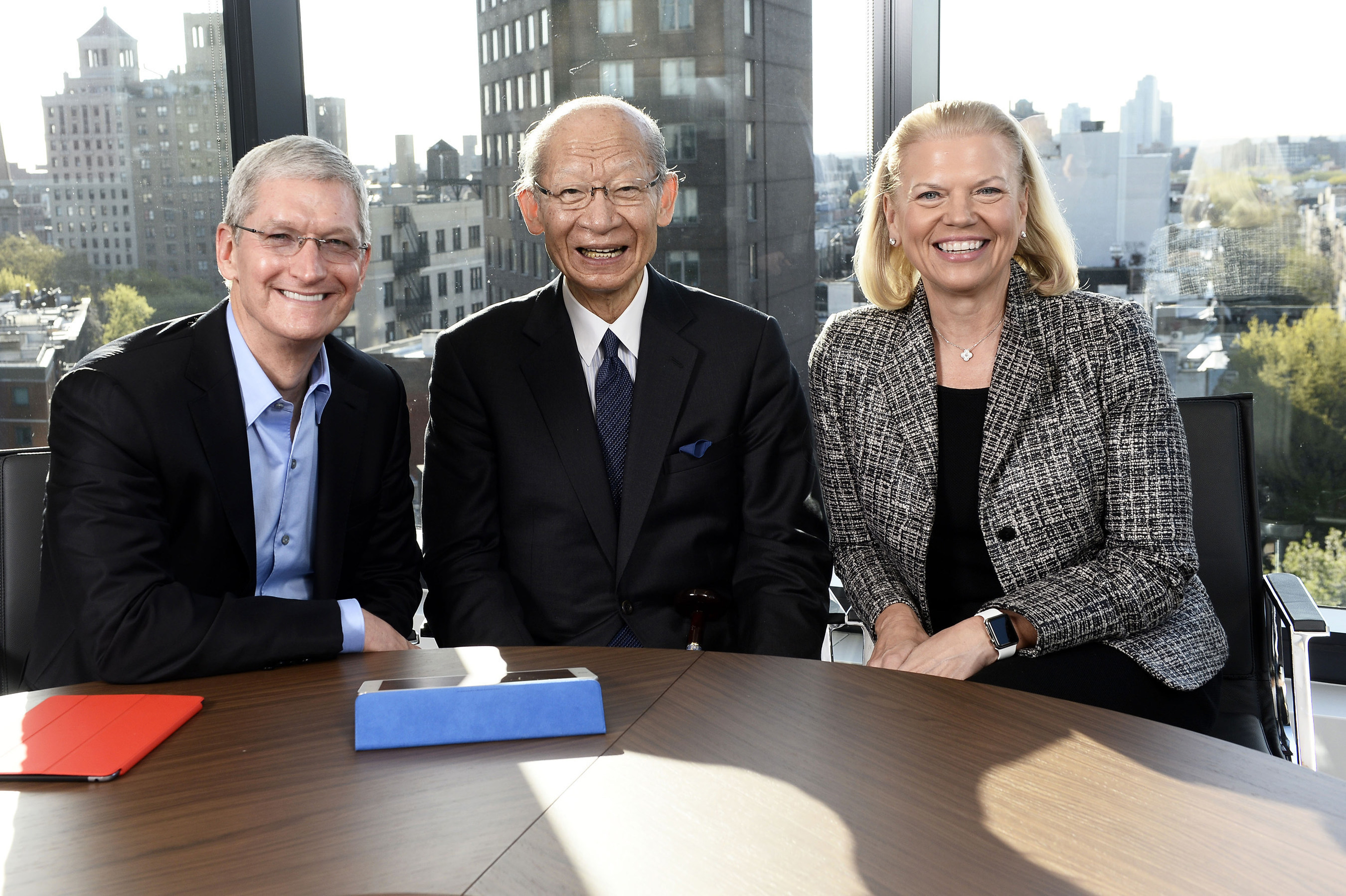 Apple CEO Tim Cook, left, CEO of Japan Post Holdings Mr. Taizo Nishimuro and IBM CEO Ginni Rometty announce a first-of-its-kind initiative to address the economic and societal issues of the aging population in Japan in New York City on Thurs., April 30, 2015. Building on the landmark Apple-IBM partnership, the companies plan to bring the power of iPad together with IBM-developed apps and the accessibility technologies of IBM and Apple to connect millions of seniors in Japan with services, communities and their families.