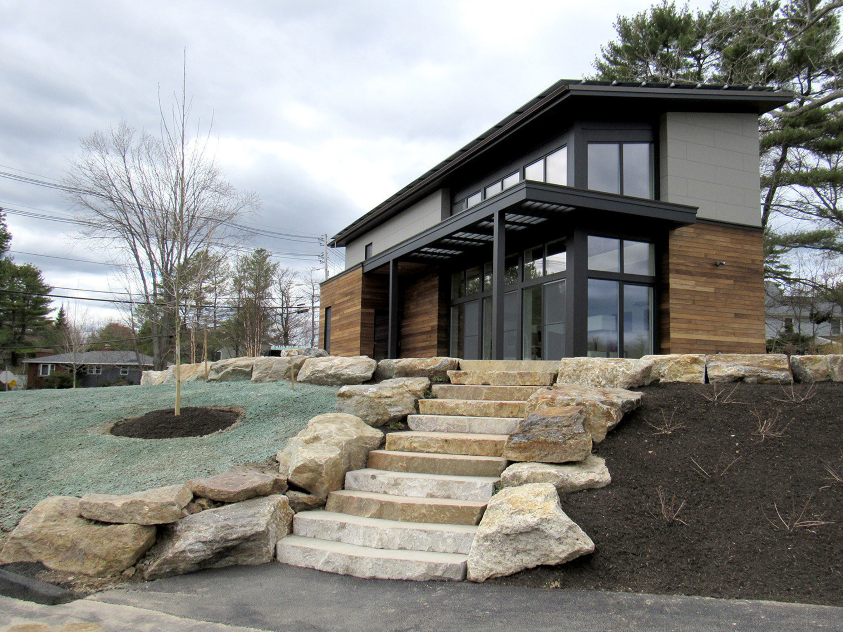 Exterior shot of The Viridescent House, Maine's first net-positive Passive House. Located at TideSmart Global's campus at 380 Route 1 in Falmouth, Maine.
