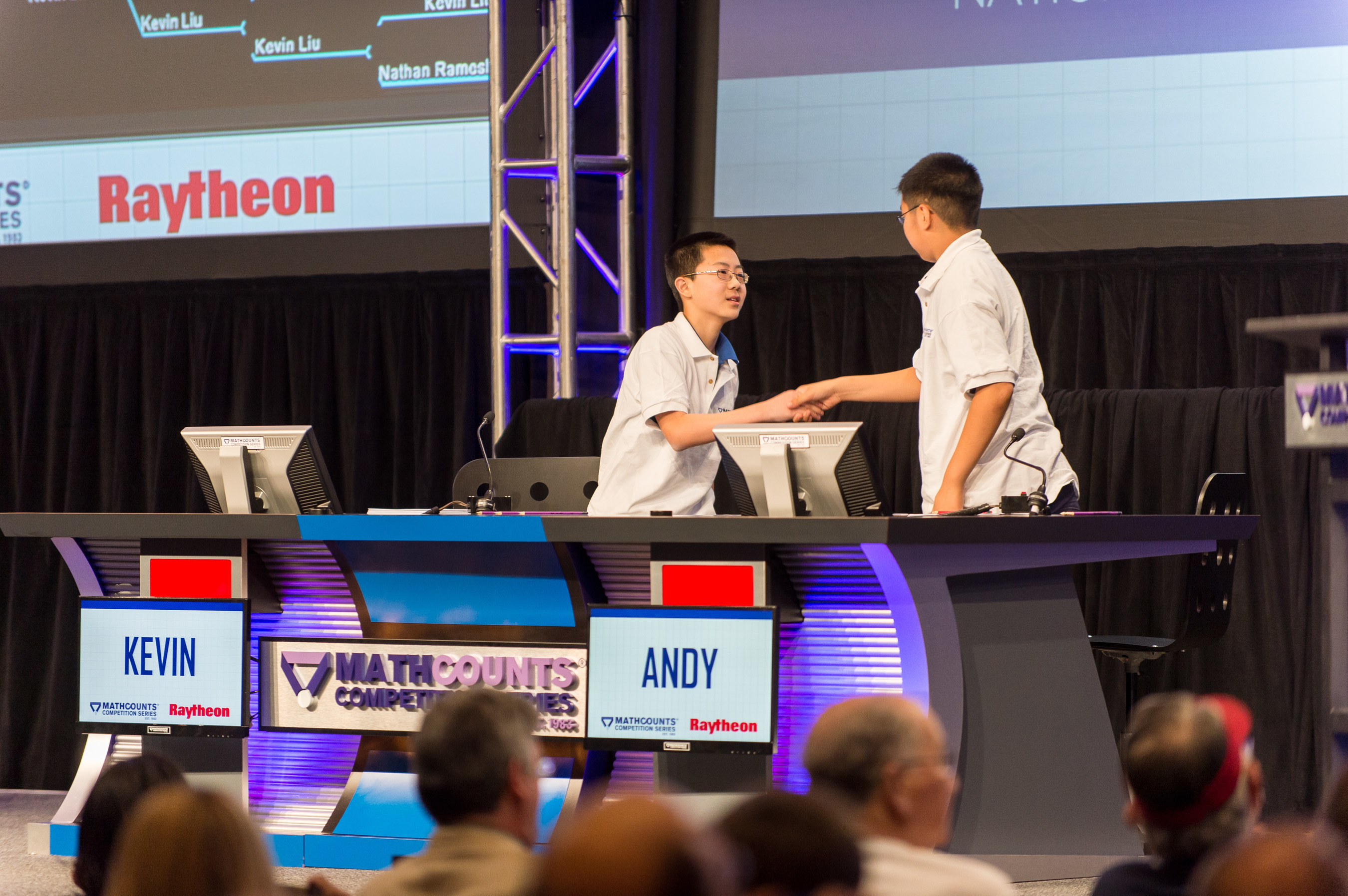 Kevin Liu, left, the 2015 Raytheon MATHCOUNTS National Champion, shakes the hand of runner-up Andy Xu after the final question of the Countdown Round at the Sheraton Boston Hotel. Liu, 14, of Carmel, Indiana, was among 224 U.S. middle-school math students who took part in this year's competition.