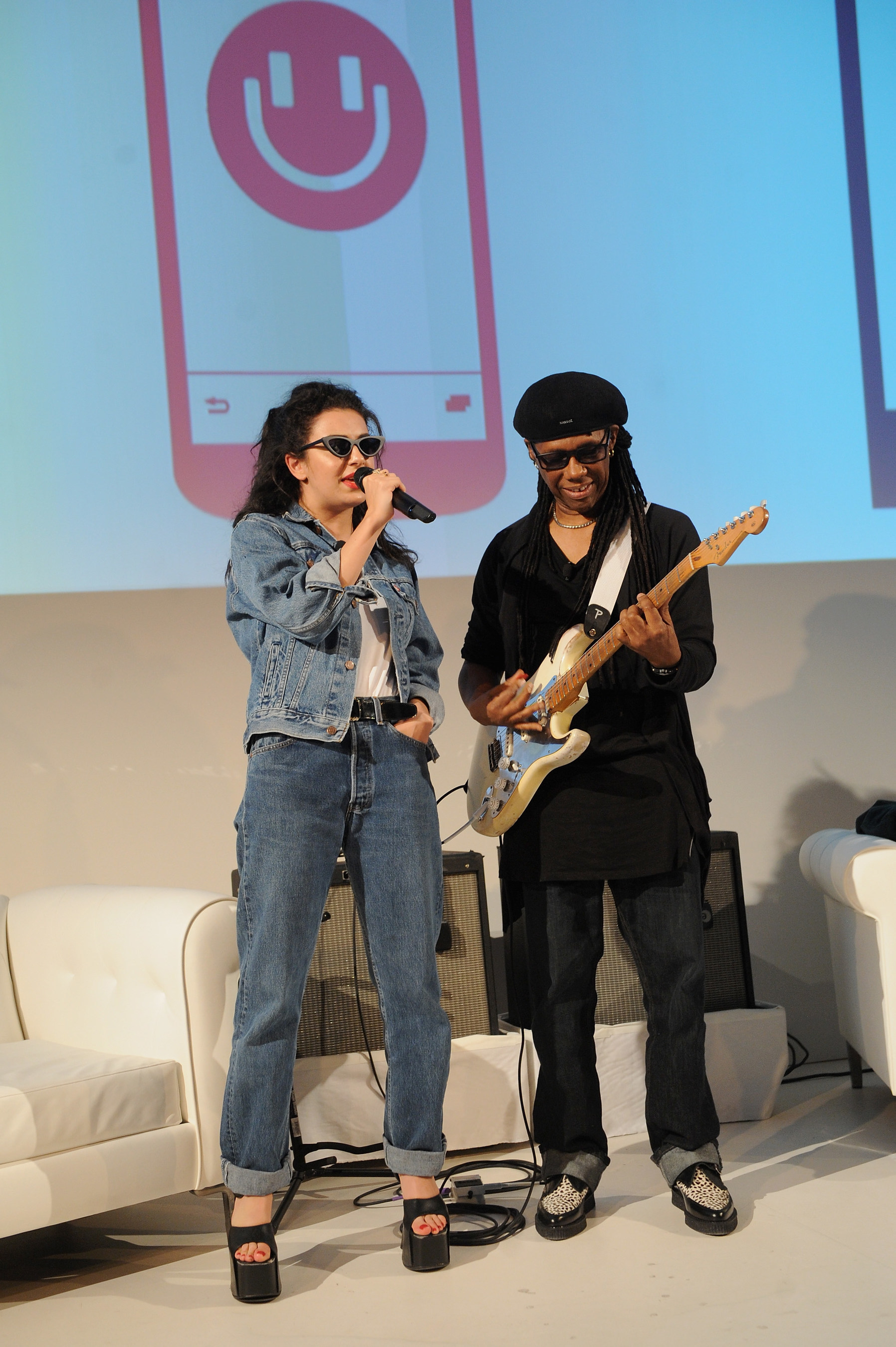 NEW YORK, NY - MAY 19:  Singer-songwriter Charli XCX and musician Nile Rodgers perform on stage at the MixRadio iOS and Android launch event at 404 on May 19, 2015 in New York City.  (Photo by Brad Barket/Getty Images for MixRadio)