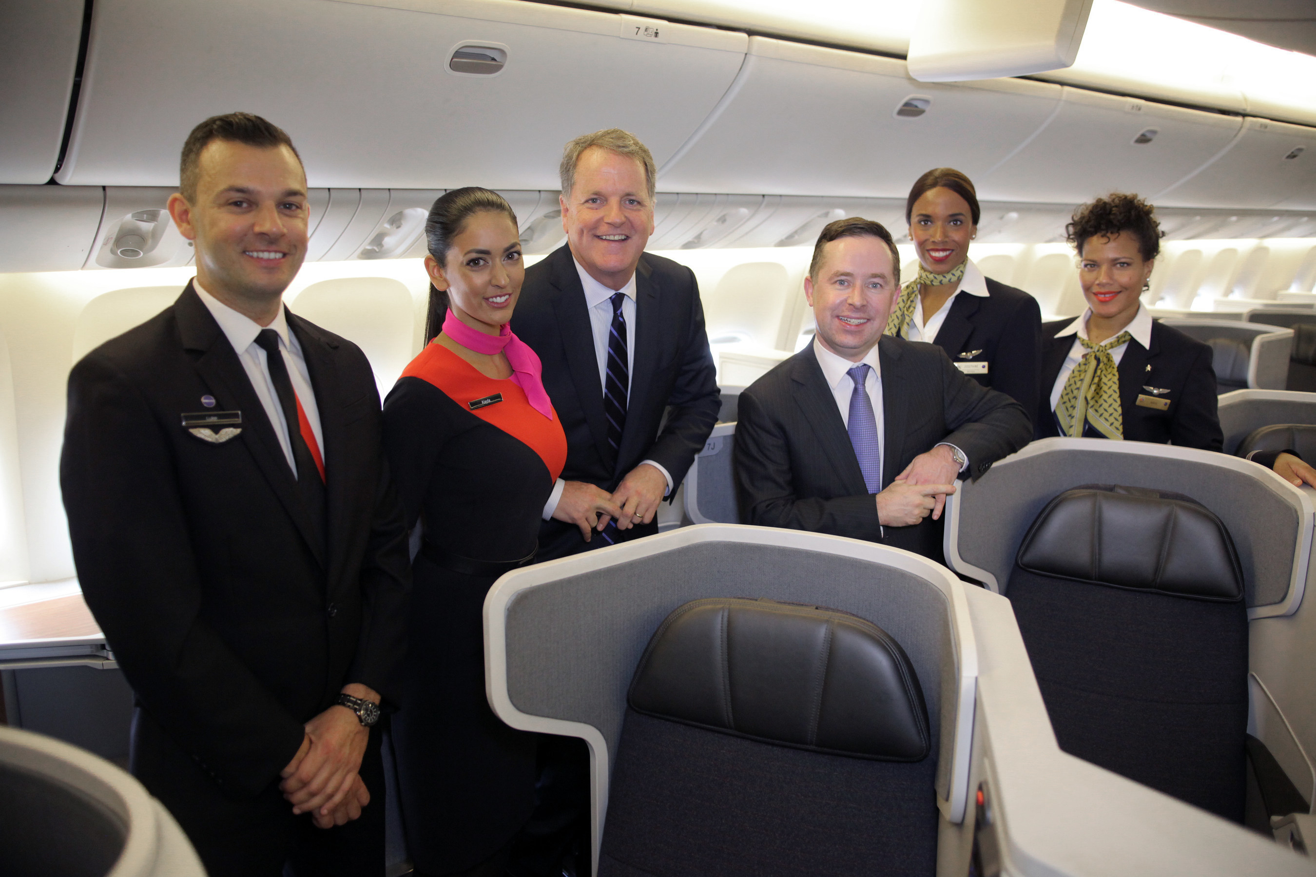 Doug Parker, CEO of American Airlines and Alan Joyce, CEO of Qantas Airways are joined by crew members on board American's Boeing 777-300ER.