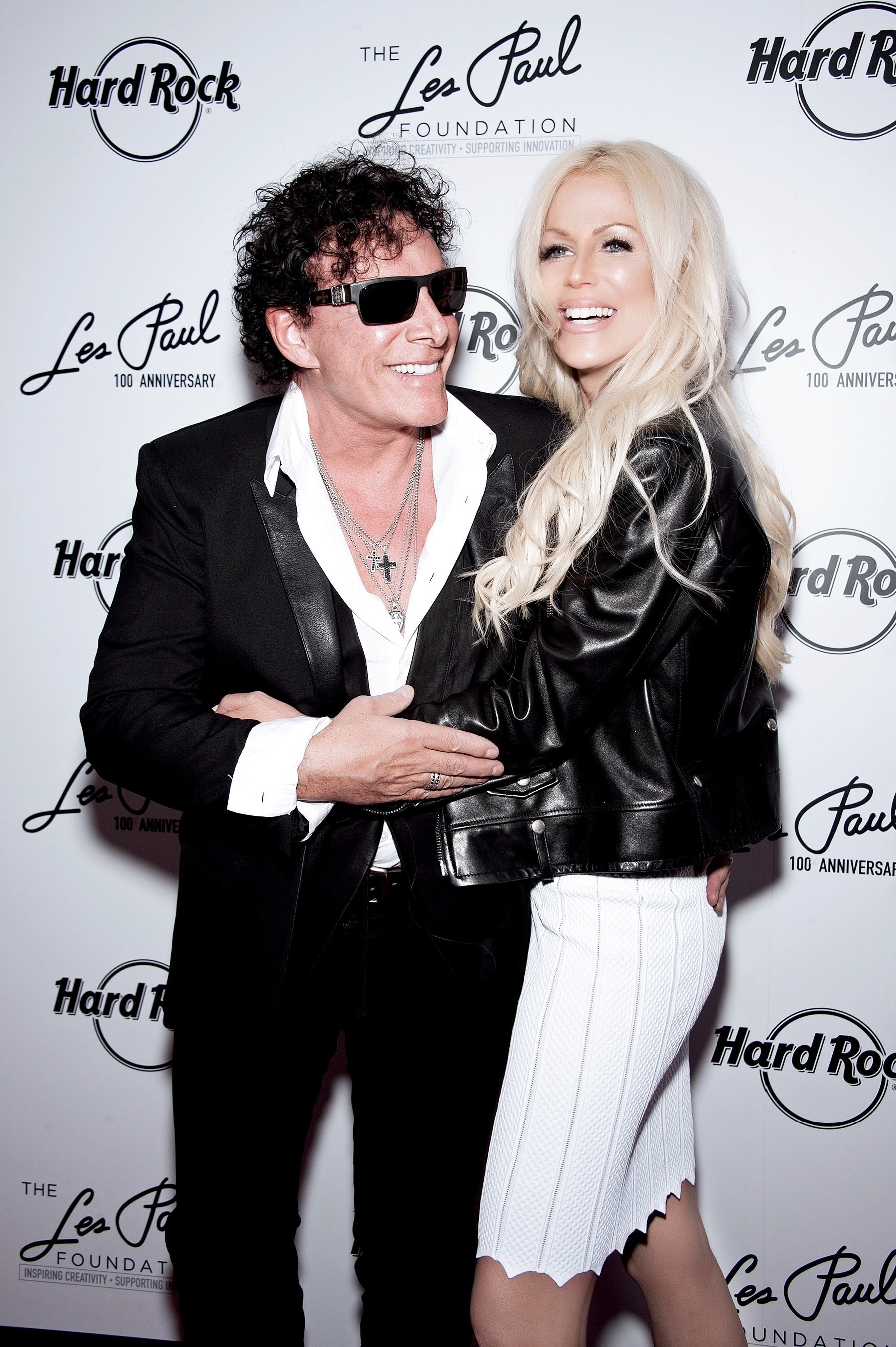 Neal Schon (L) and wife Michaele Schon attend Les Paul's 100th Anniversary Celebration at the Hard Rock Cafe - Times Square on June 9, 2015 in New York City.