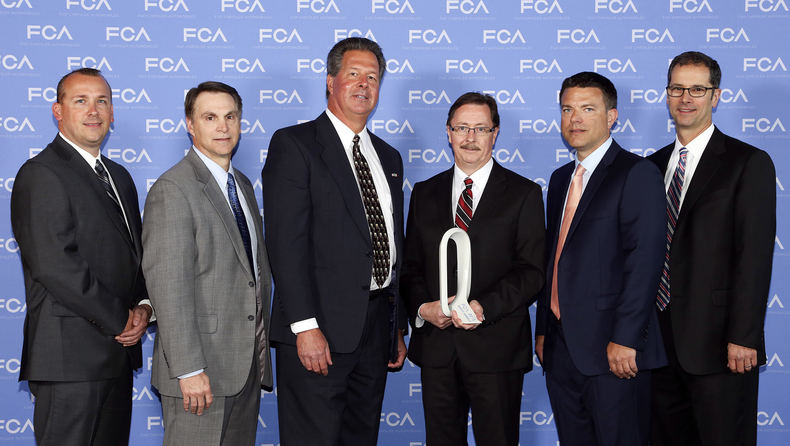 Vari-Form was honored as 2015 Supplier of the Year for Supply Chain Management during the Qualitas Annual Strategy Meeting and Supplier Awards Ceremony held recently at the MotorCity Hotel in Detroit. Scott Garberding, Head of Group Purchasing, Fiat Chrysler Automobiles N.V. (FCA) (at right), and Tom Finelli, Head of North America Group Purchasing FCA US (to his right), presented the award to Vari-Form executives Doug Viohl and Randy Nicholls (center). Also present were Christopher Barrette...