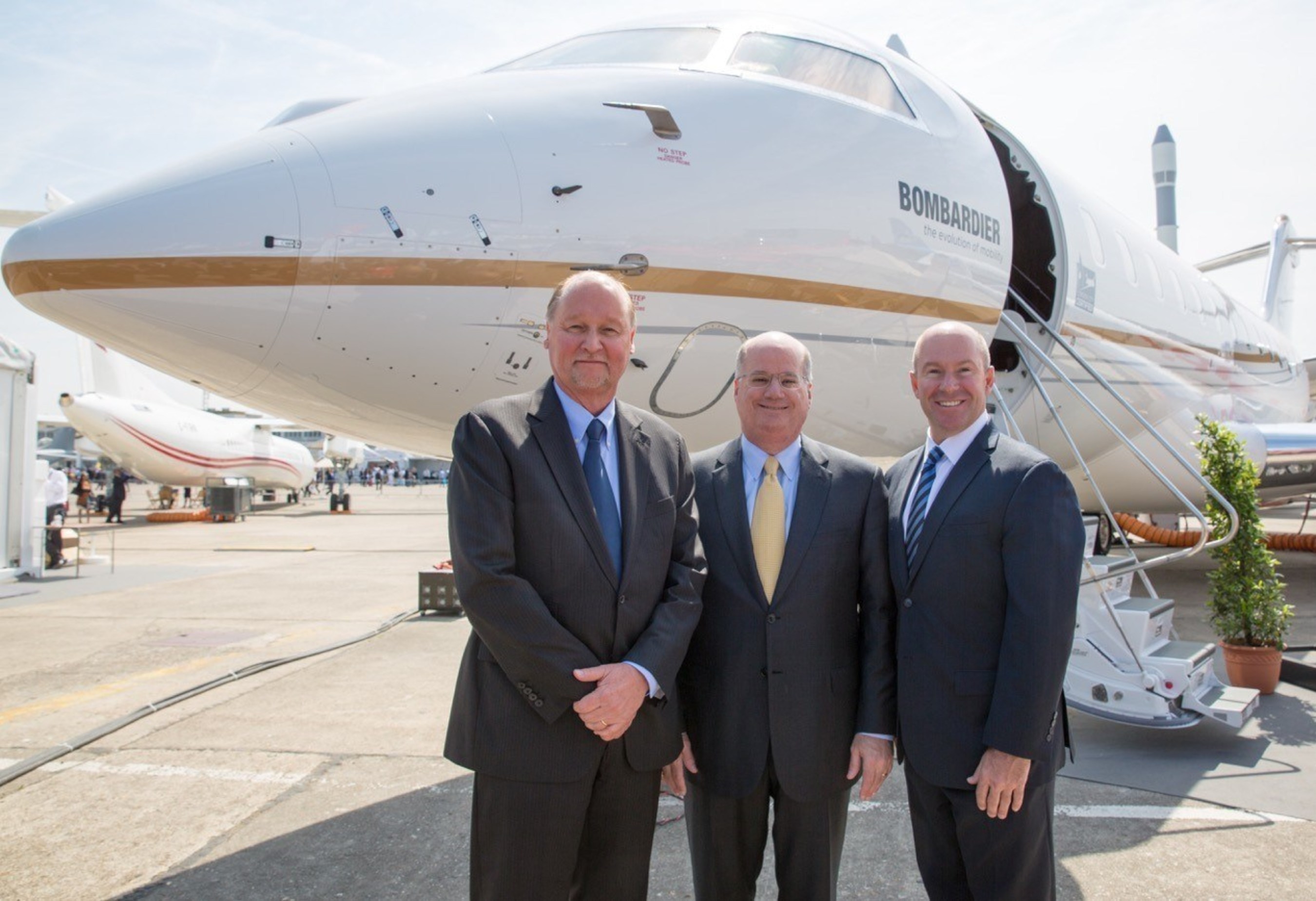 (from left to right) Rick Yuse, Raytheon, Orlando Carvalho, Lockheed Martin, and Alain Bellemare, Bombardier, meet at the Paris Air show, representing their best of breed team for the Air Force's JSTARS Recap program.