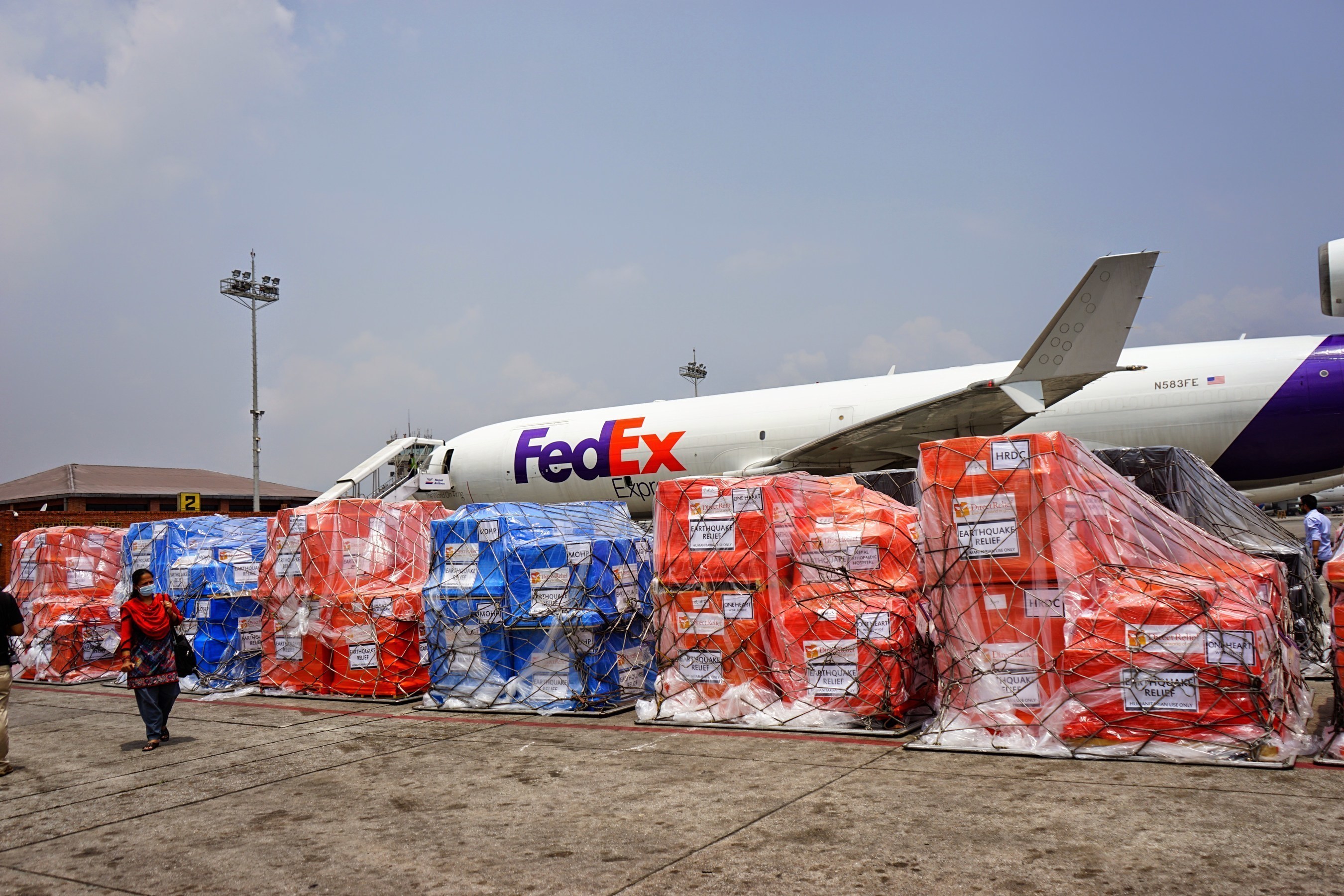 Nepal Earthquake Response: Medical aid pallets from Direct Relief unloaded from cargo flight donated by FedEx. 5.9.15.