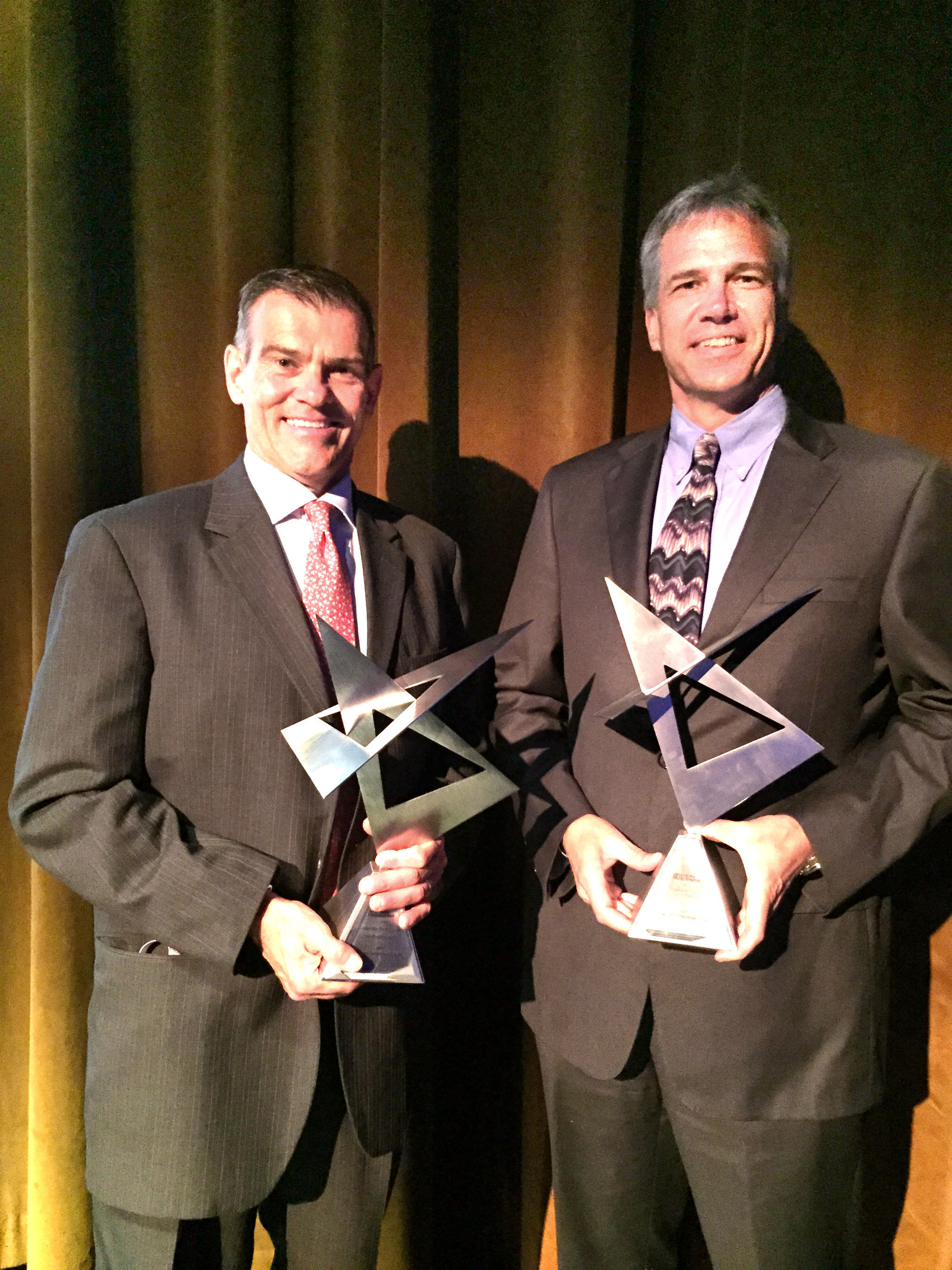 John Coll, vice president of sales and marketing and Peter Campo, president, accept AMM awards on behalf of Gerdau Long Steel North America.