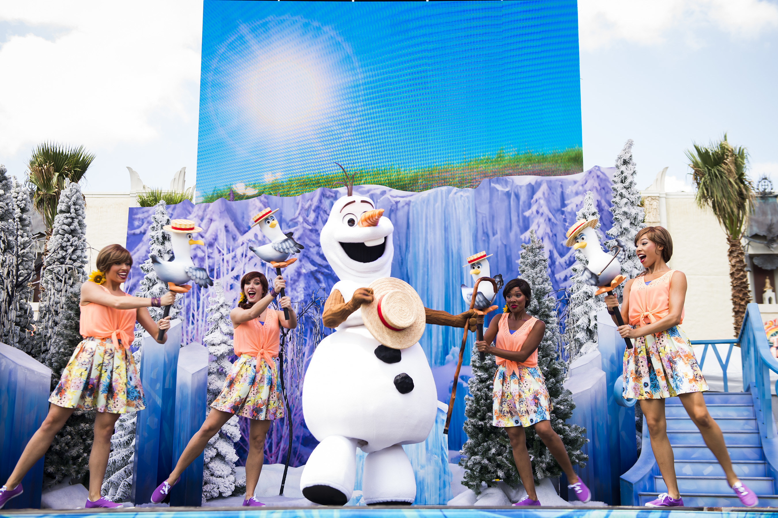Several times each day from June 17 through Sept. 7, the Ambassador of Hollywoodland brings Olaf and some of his friends to the Event Stage at Disney's Hollywood Studios to have a little fun with everyone "In Summer." And as temperatures heat up, Olaf happily shares a burst from his personal snow cloud to cool things off. It's all part of "Frozen" Summer Fun, now at Disney's Hollywood Studios, one of four theme parks at Walt Disney World Resort in Lake Buena Vista, Fla. (Ryan Wendler, photographer)