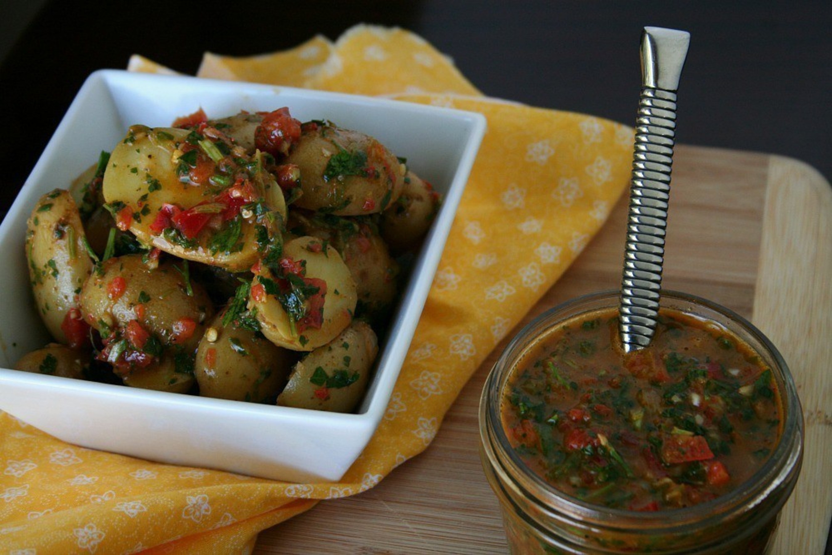 Latino Foodie's Red Chimichurri Idaho(R) Potato Salad creatively uses chimichurri sauce, often served as an accompaniment to grilled meat in Argentina, to enhance the earthy flavor of Baby Dutch Yellow Idaho(R) Potatoes.