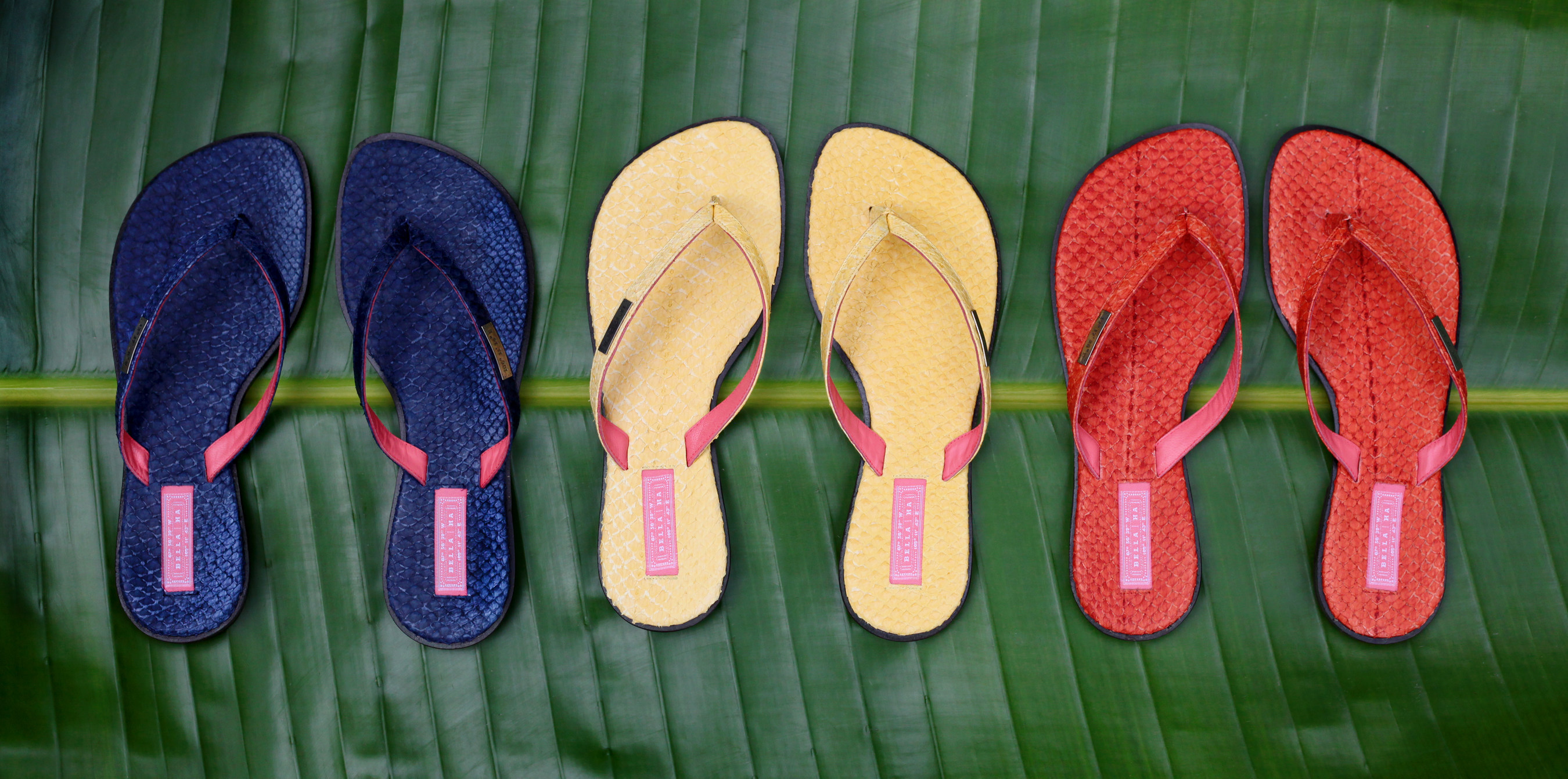 Three of the six different colors of Bella | Ha Khanh Hoa collection shoes. The tags on each shoe give the longitude and latitude of the Khanh Hoa province in Vietnam, where the first Solar Suitcase was donated.