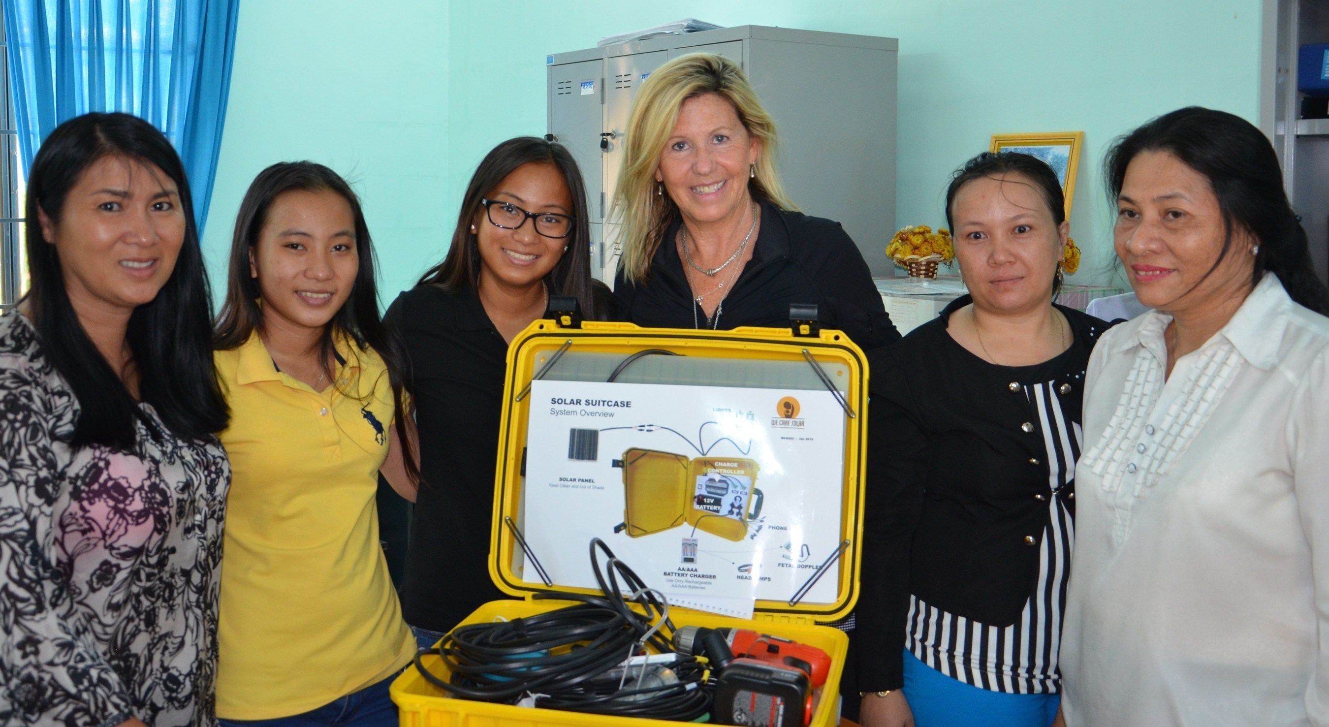 Keely Solimene of Bella | Ha, alongside twins, Isabella and Ha deliver the first Solar Suitcase to a remote clinic in the Khanh Hoa province of Vietnam.