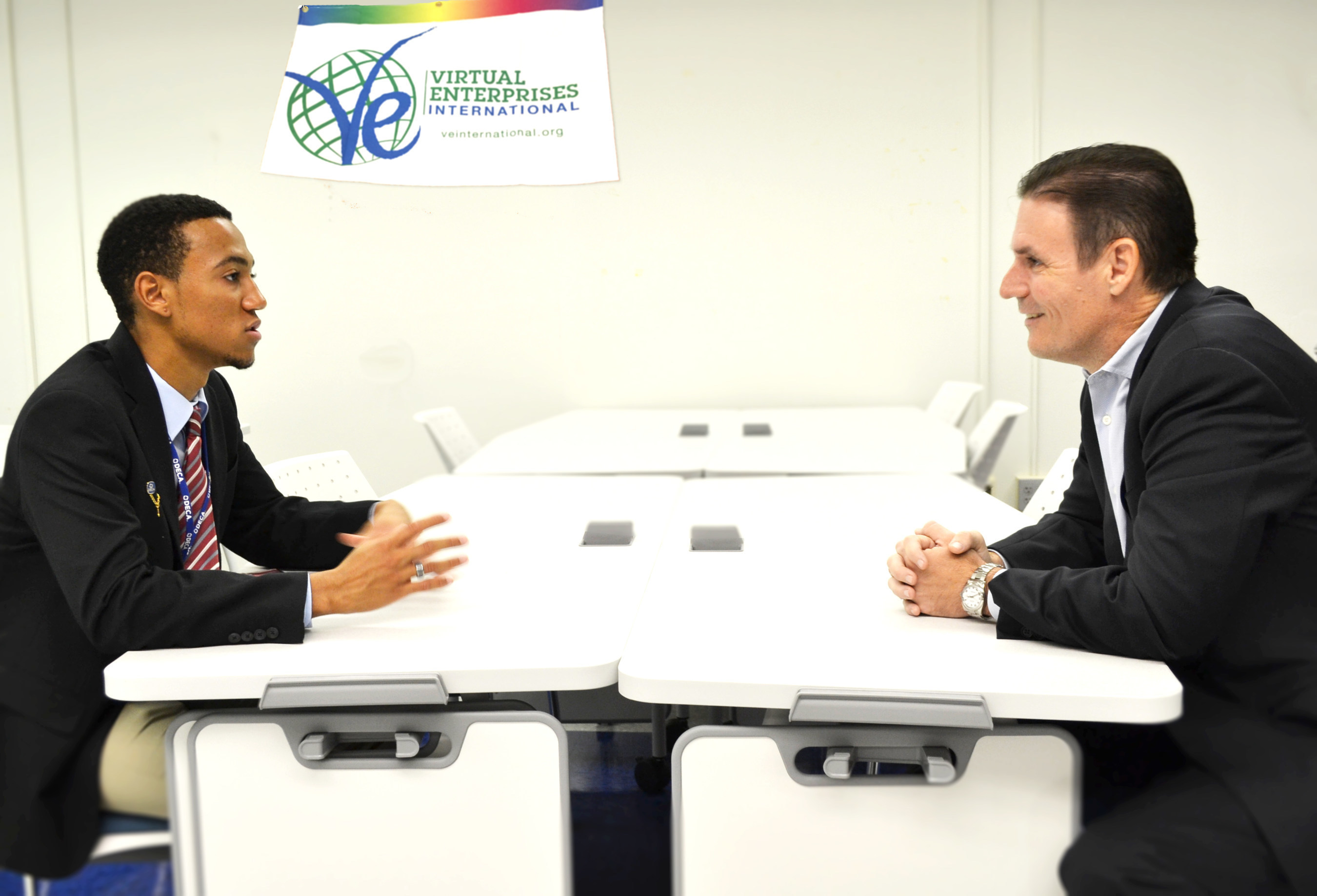 Digital Risk Co-founder & Managing Partner Jeff Taylor interviewing J.P. Taravella High School student Aaron Mitchell, newly elected CEO of the school's VEI program.